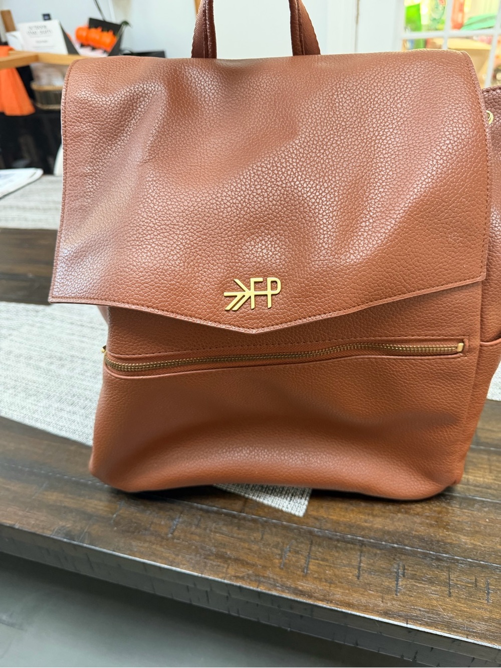 Freshly Picked Brown Leather-Textured Backpack with Gold Logo